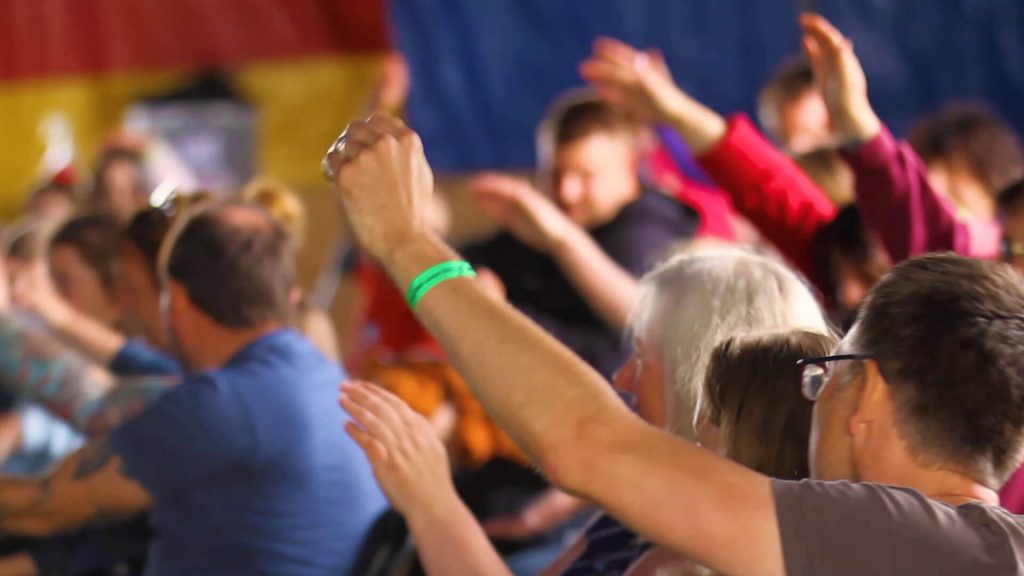 Audience raising hands