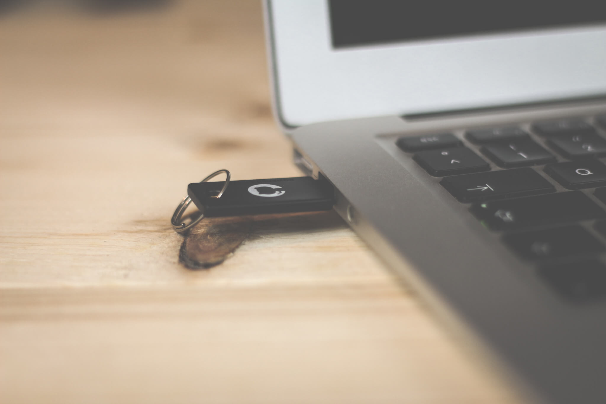 Black USB pen in laptop